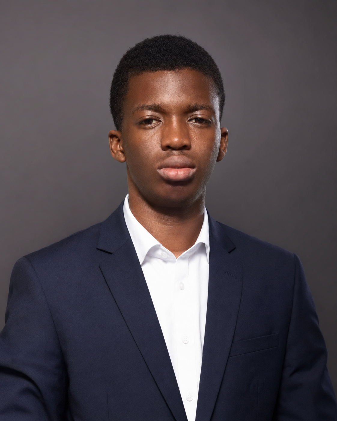 Engr. Miqdad Bada Akorede, Founder and CEO of ILM Nexus, working on a laptop